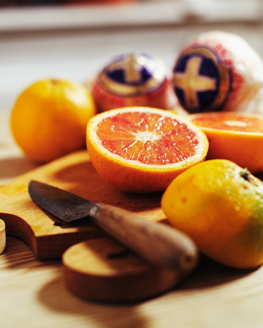 Whole and halved blood oranges