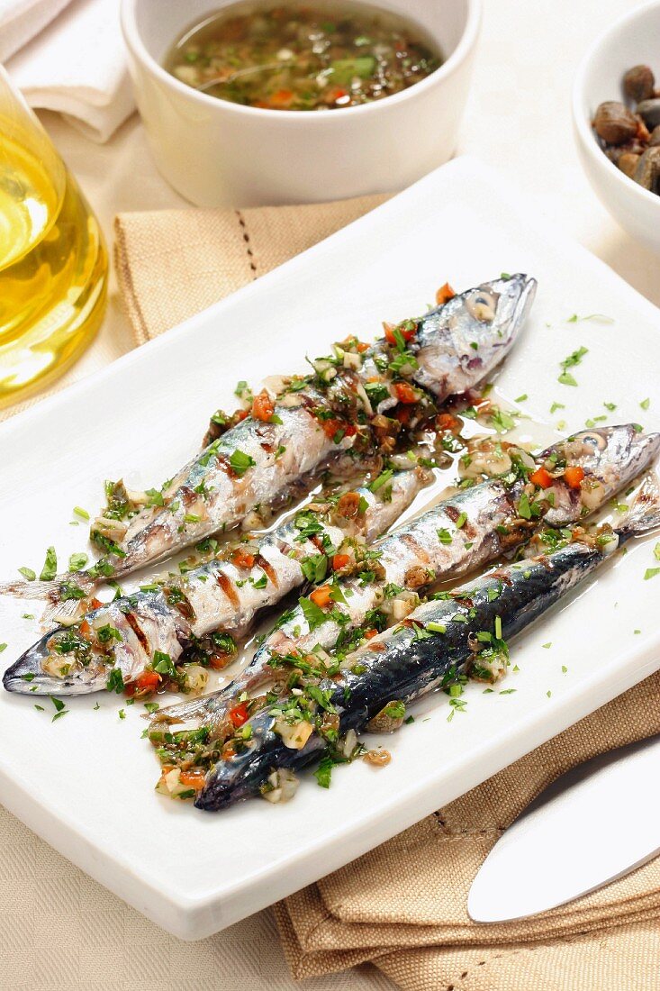 Grilled mackerel with spicy sauce and capers, Italy