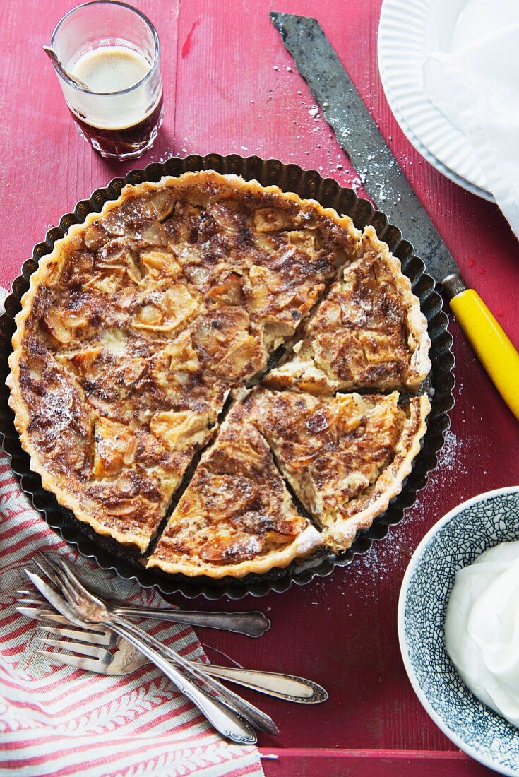 Fruit tart with whipped cream and coffee