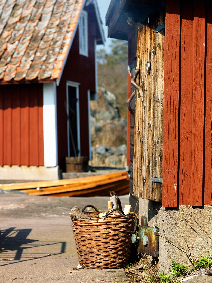 Firewood in front of a smokehouse, Sweden.