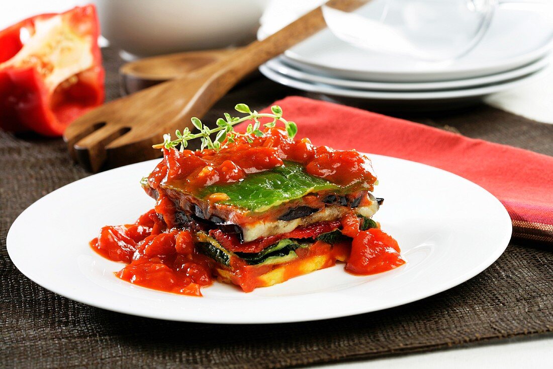 Layered grilled vegetables with tomato sauce