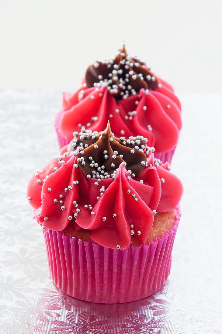 Christmas cupcakes with cherry & chocolate icing and silver balls