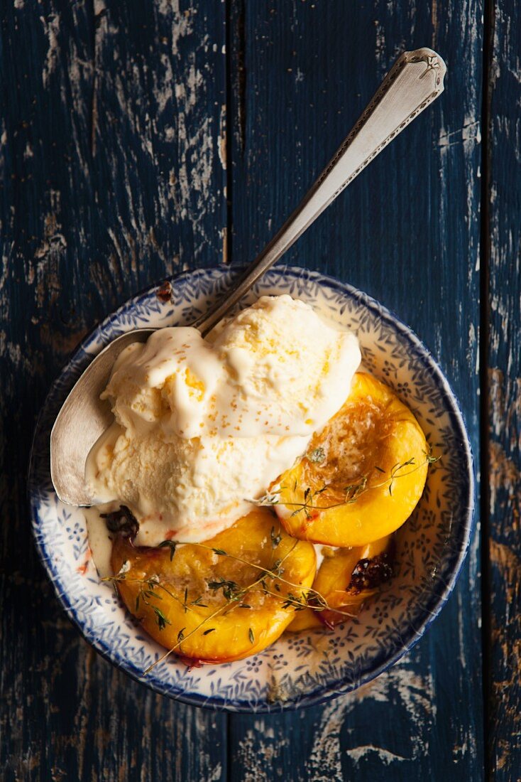 Baked nectarines with vanilla ice cream and thyme