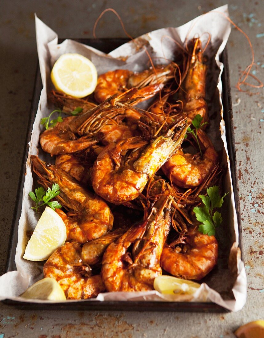 Oven-baked prawns on a baking tray