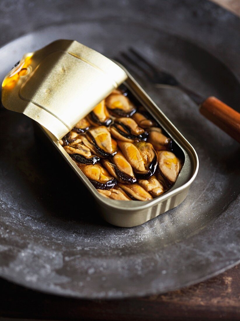 Smoked mussels in an open tin