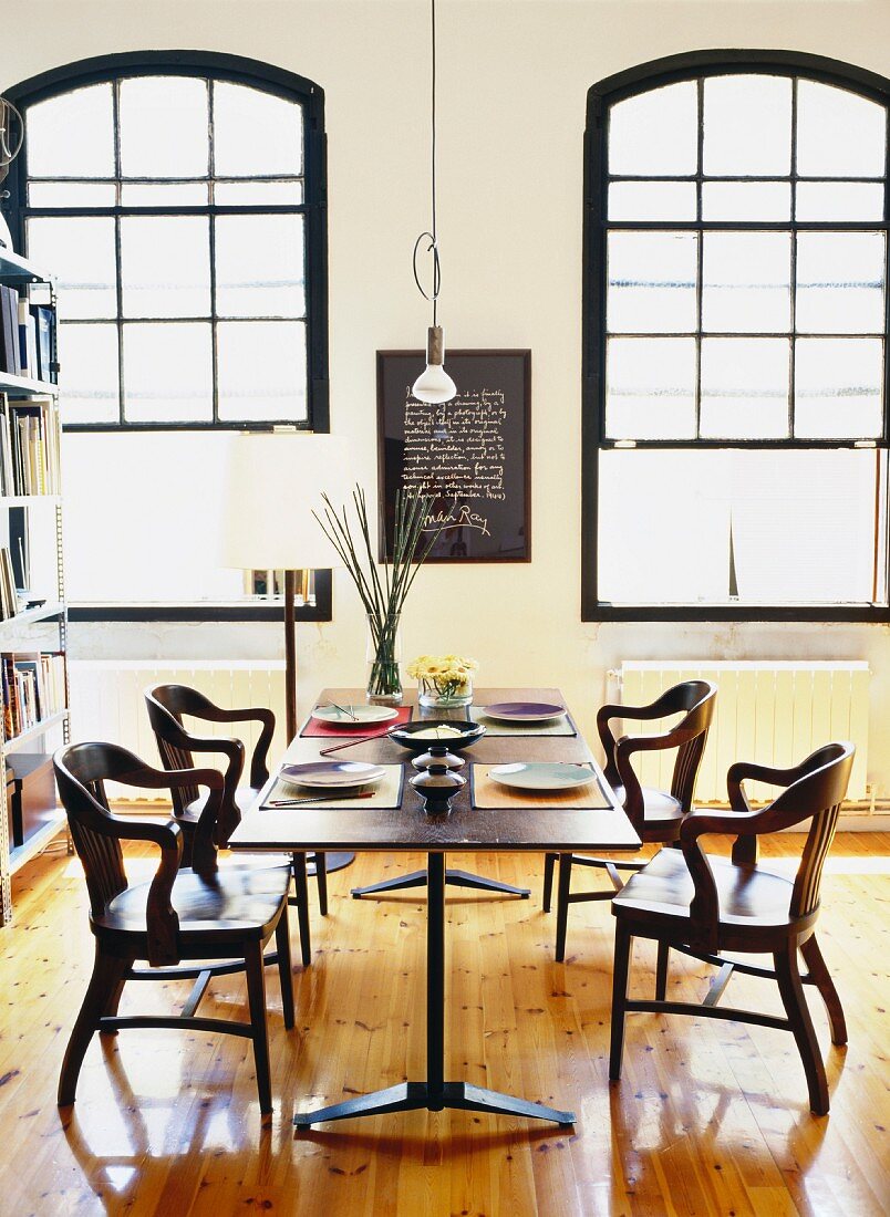 Set dining table and chairs in loft-style interior