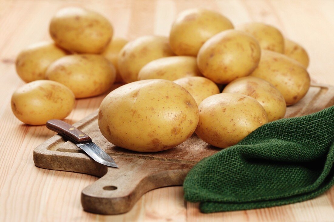 White Elfe potatoes on a chopping board