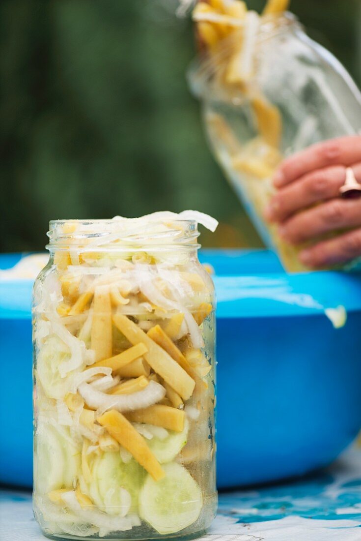 Bean and cucumber salad with onions, preserved in a jar