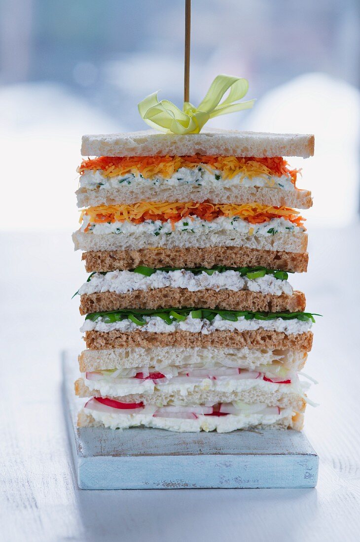 A stack of sandwiches on a skewer