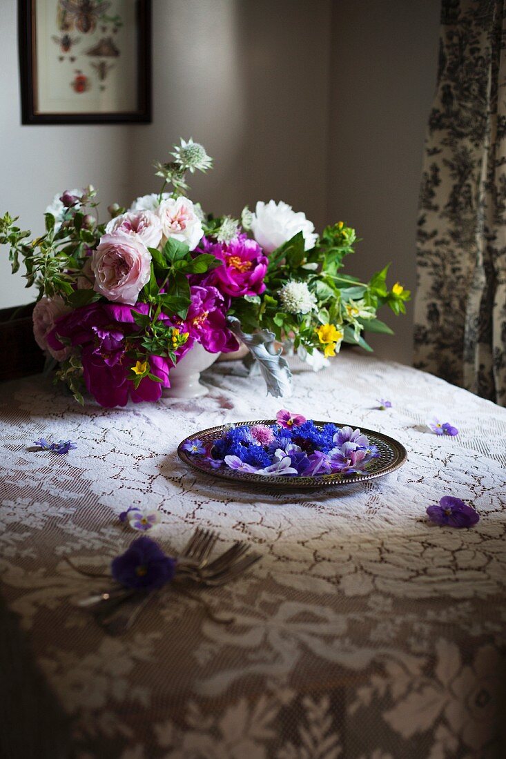 Edible Flowers on a Platter set on a Table; Cornflower, Violas and Pansies