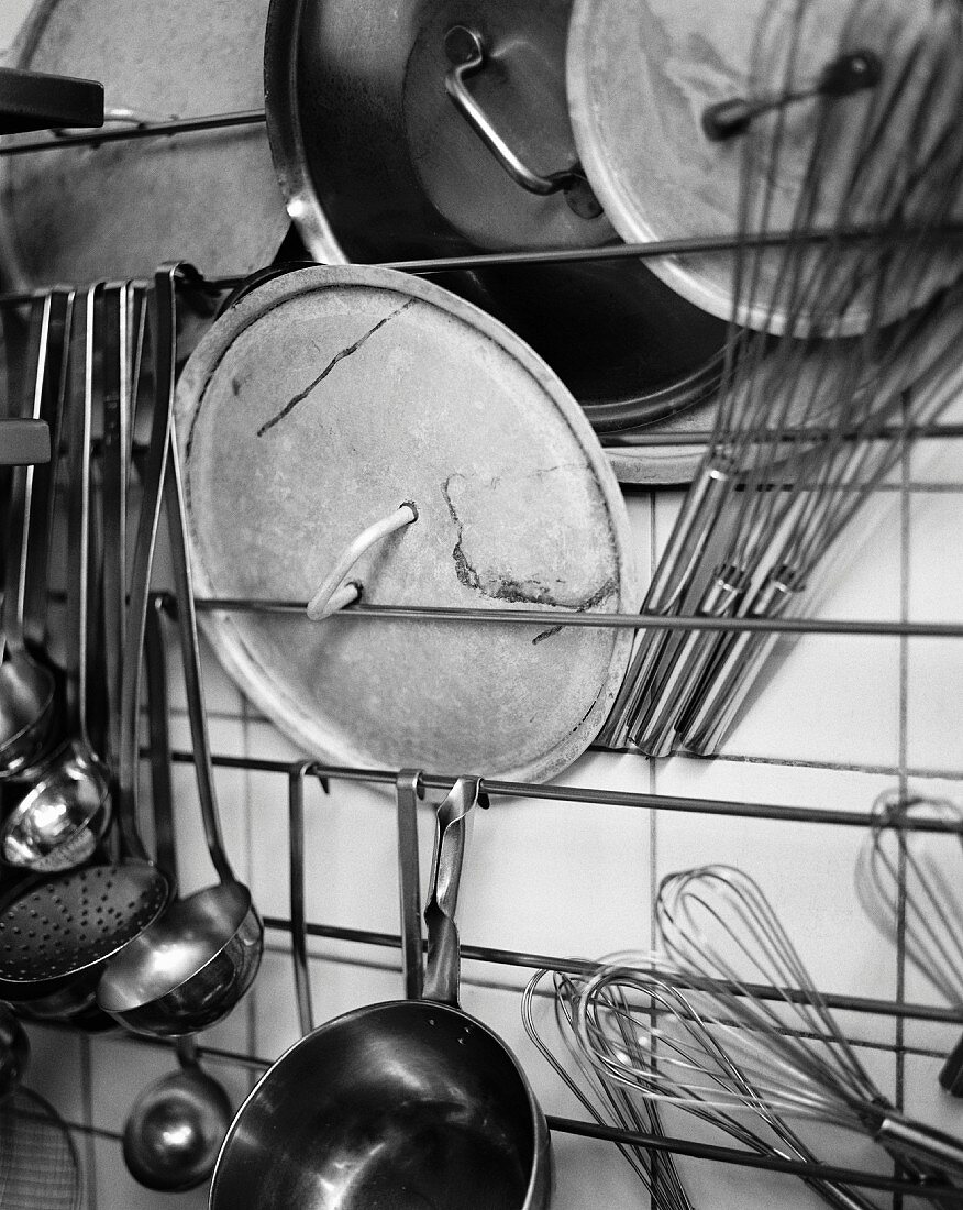 Kitchen accessories and utensils hanging on the wall