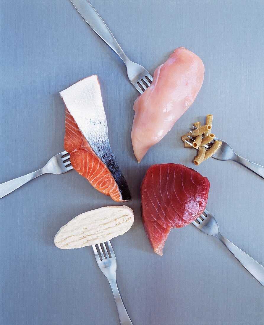 Protein-rich foods on forks (view from above)