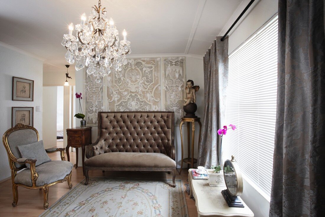 Gilt, Rococo armchair, upholstered bench with high backrest and chandelier in living room