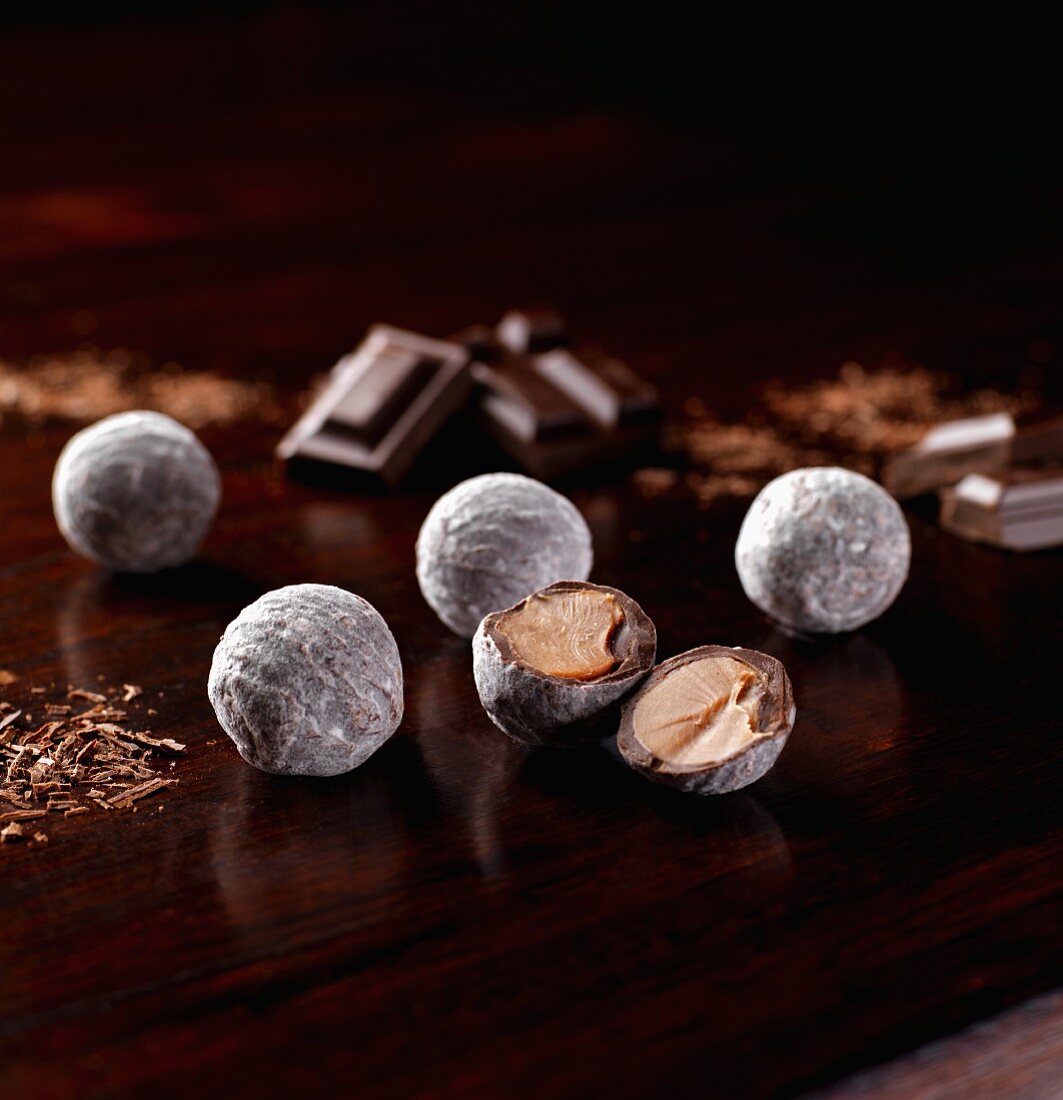 Several champagne truffles, whole and halved