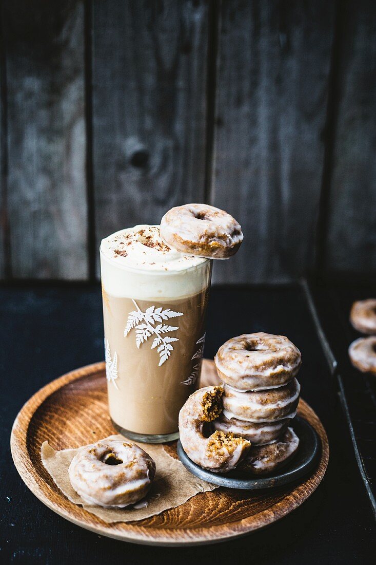 Squash doughnuts with spices, with a hot chocolate topped with cream