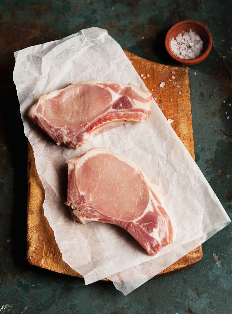 Raw pork chop in butcher paper