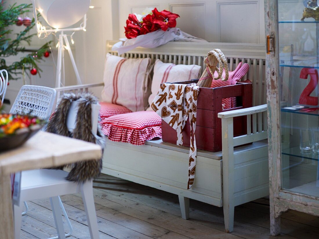 Festively decorated interior with wooden bench