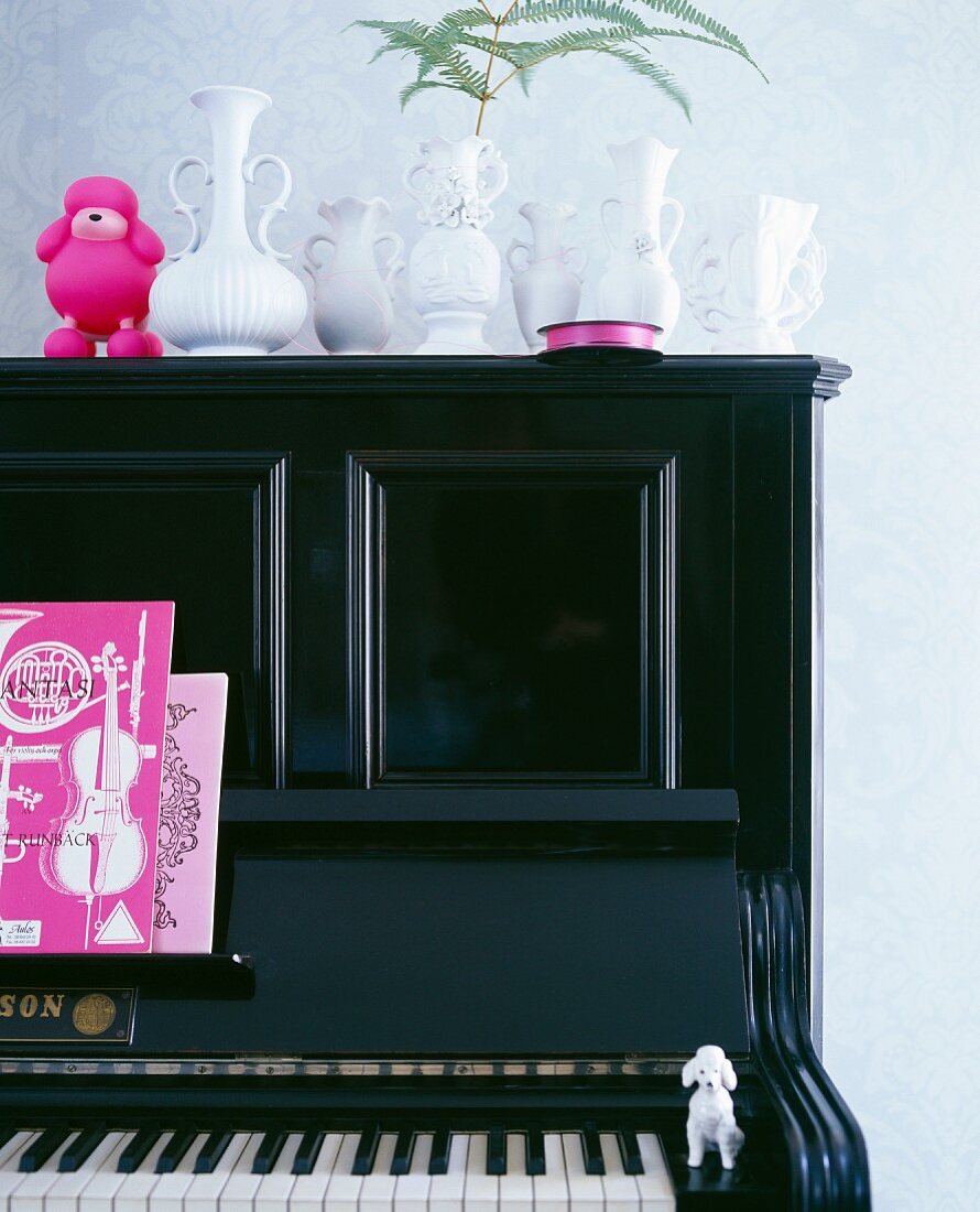 Black piano (detail) decorated with vases