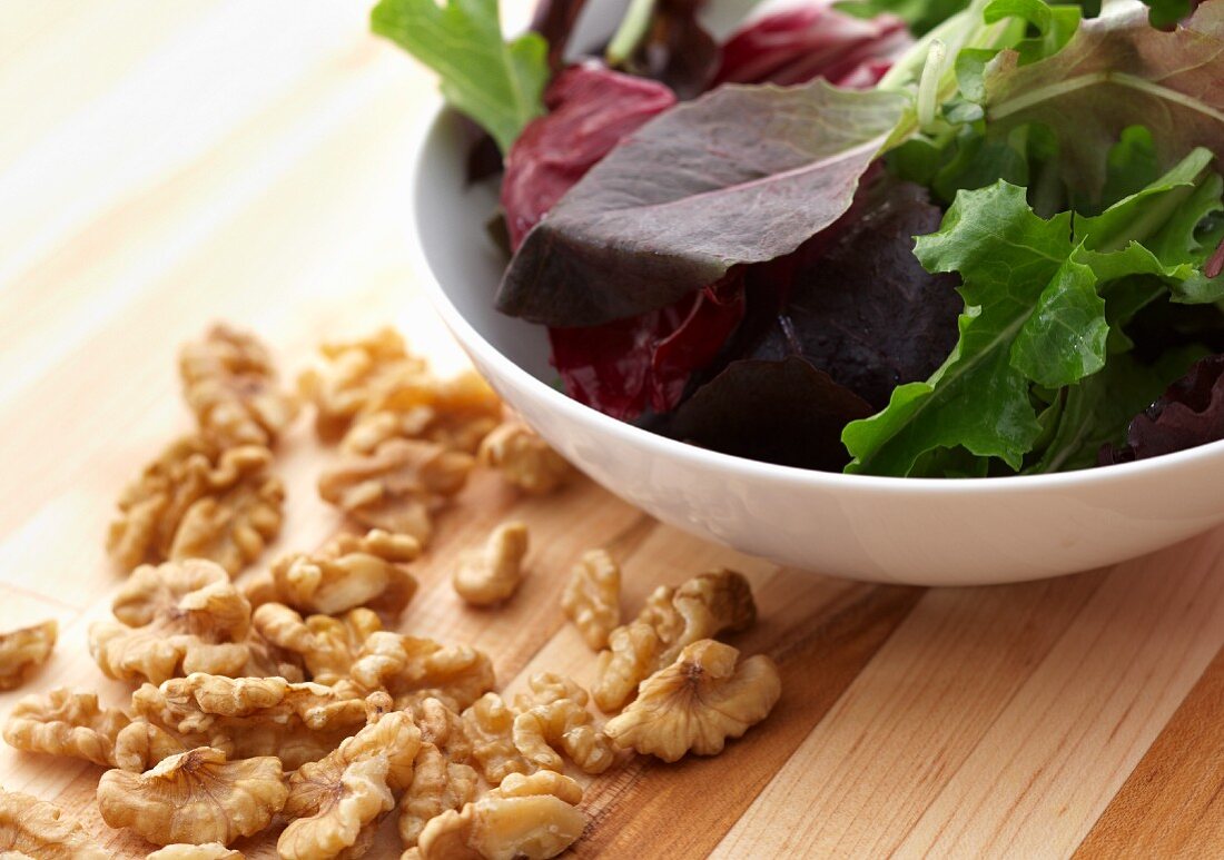 A Bowl of Mixed Greens and Walnuts