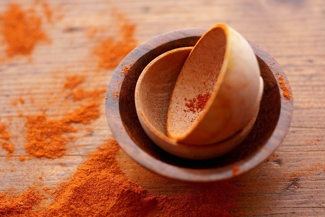 Small Wooden Bowls with Spilled Paprika