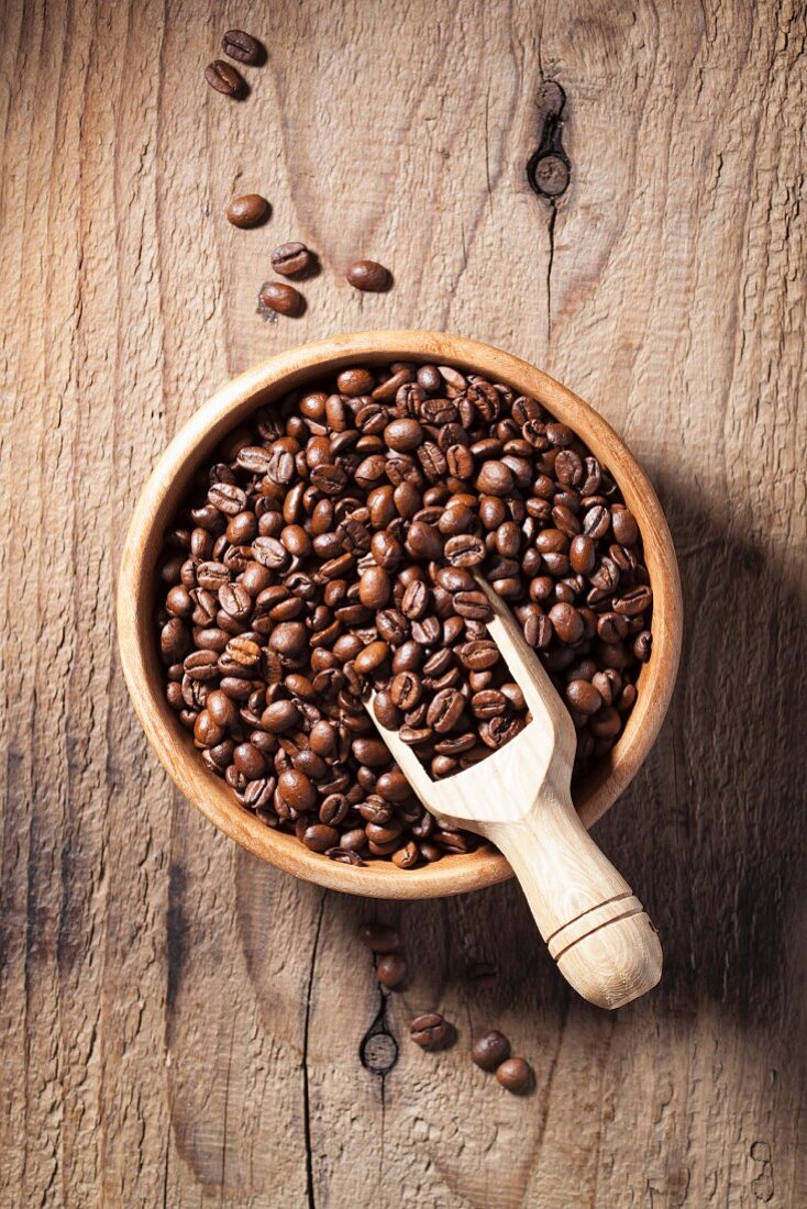 Coffee beans in a wooden bowl (view from above)