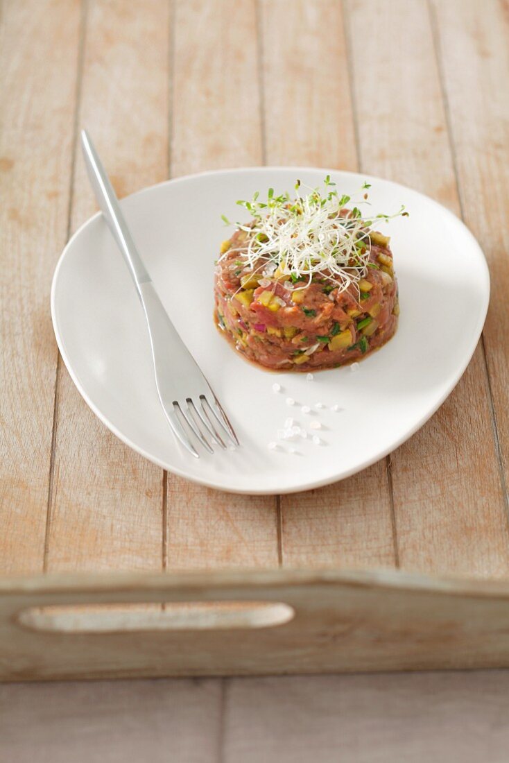Duck tartare with edible shoots