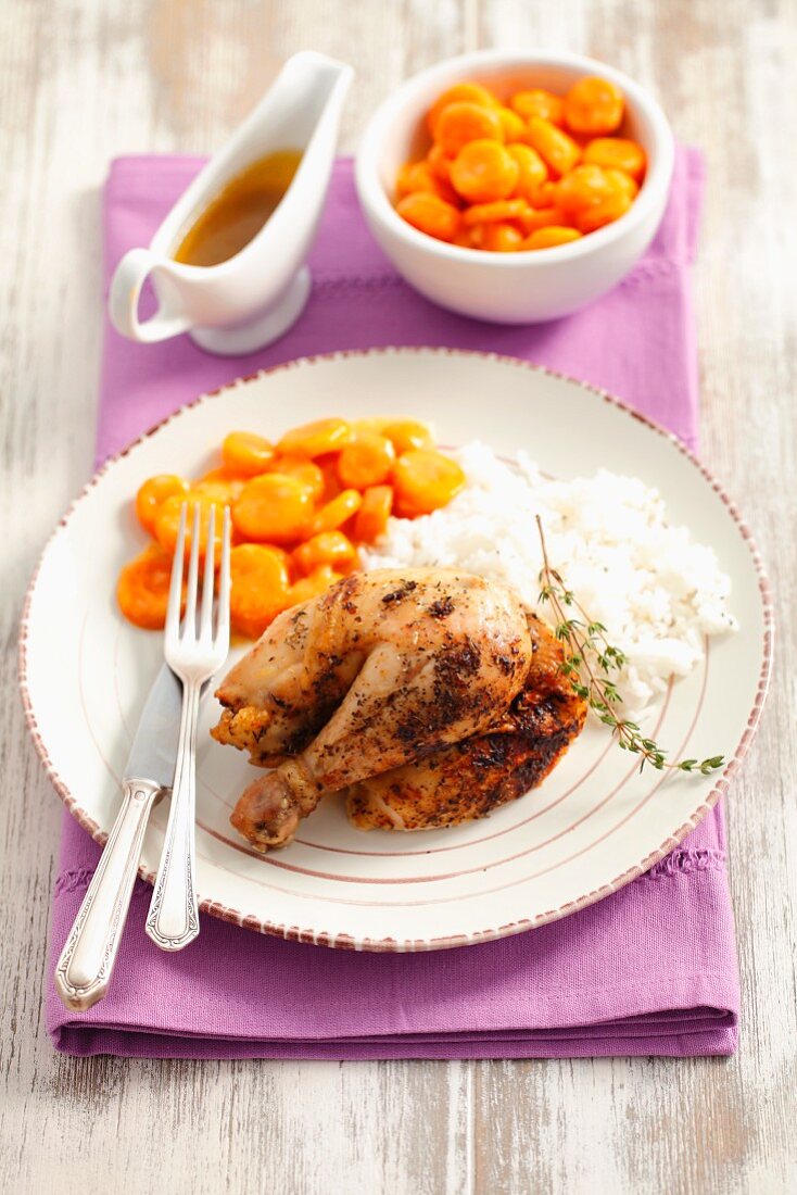 Lemon chicken with thyme, rice and carrots