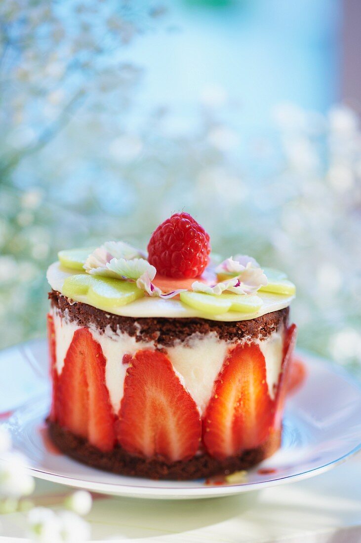 Individual chocolate layer cake with yoghurt and strawberries