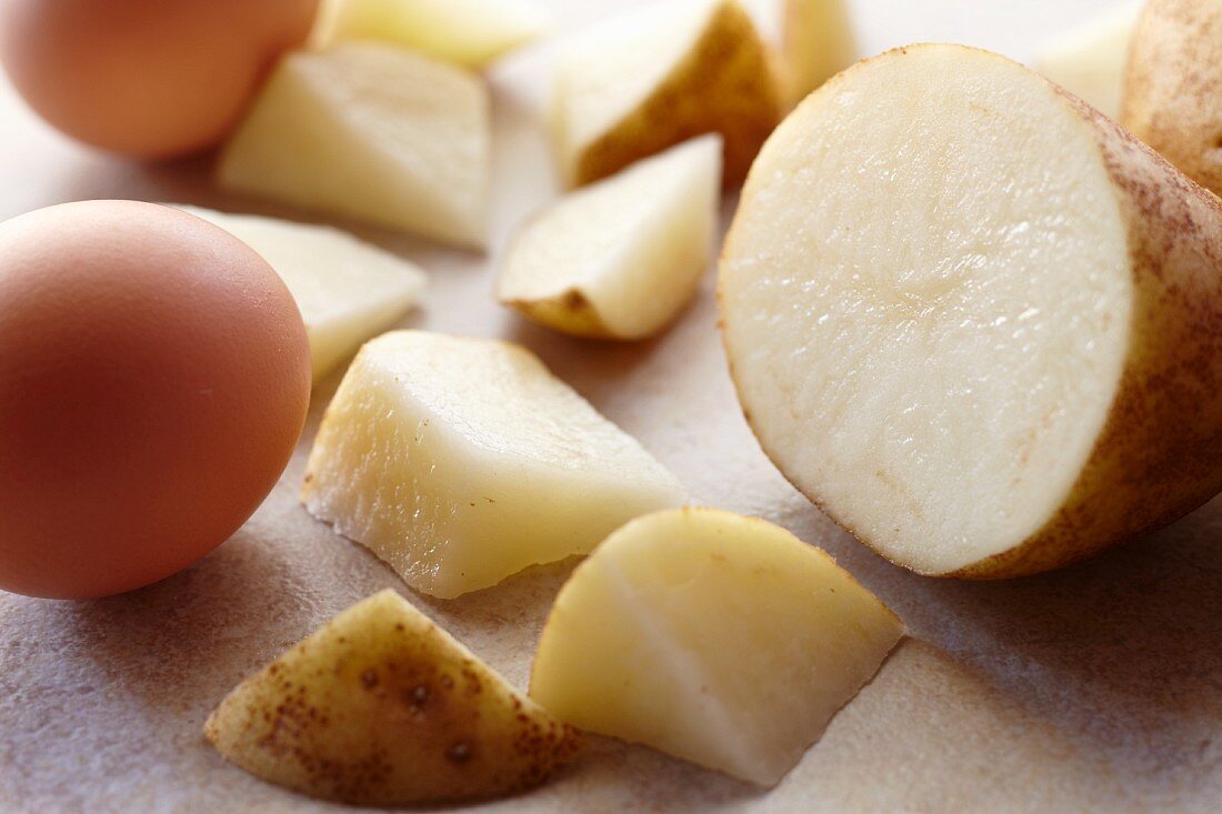 Cut Raw Potatoes and Fresh Raw Eggs