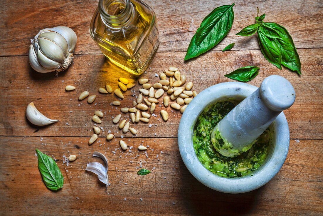 Pesto being made in a Mortar and Pestle