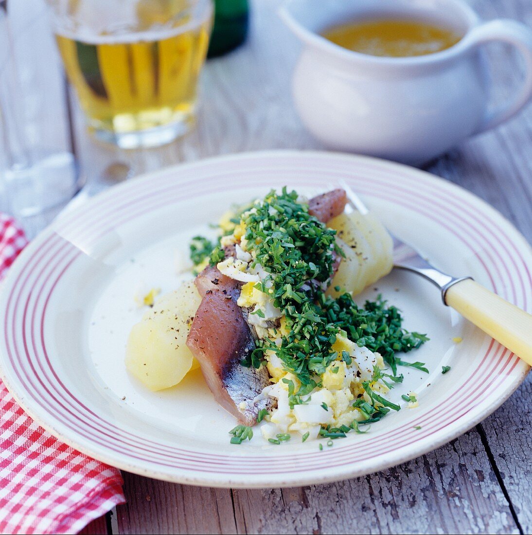 Herring with potato, egg and chopped parsley
