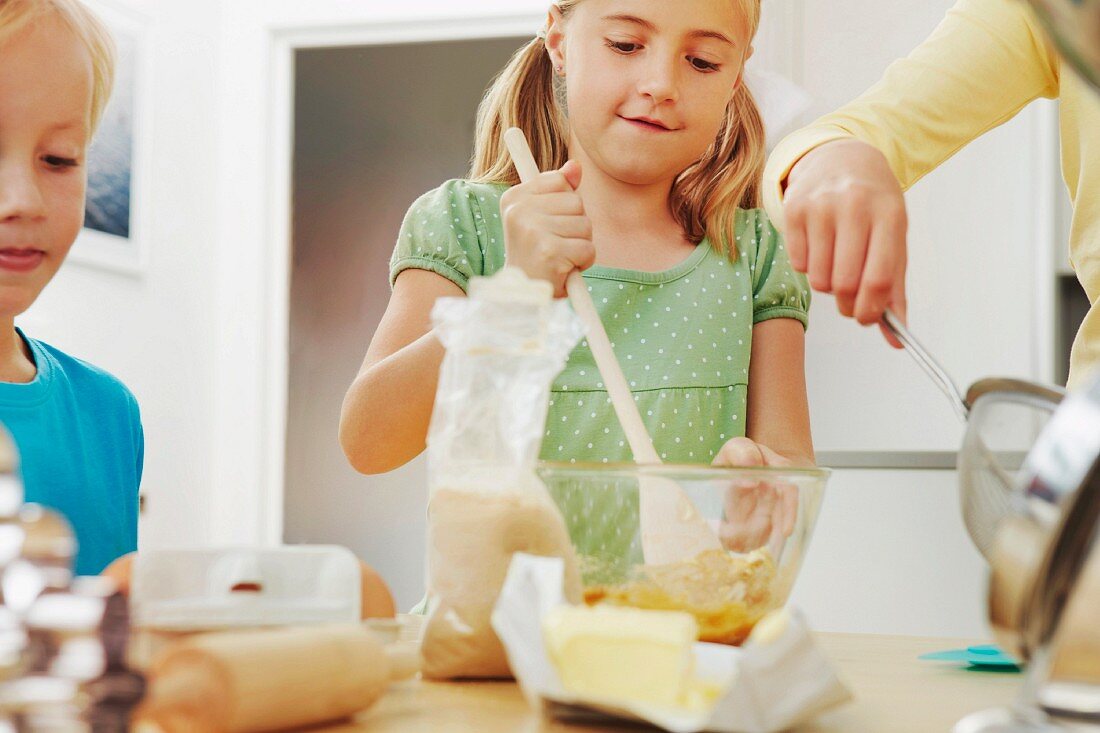 Children baking, mixing ingredients