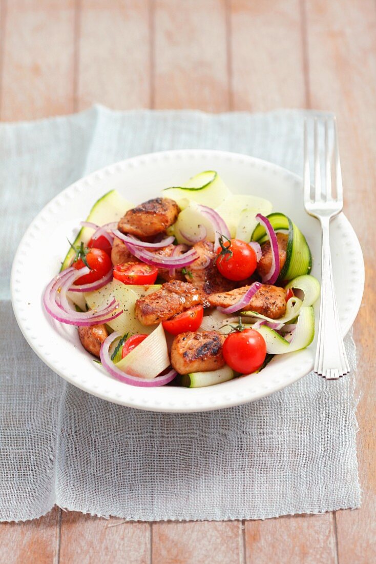 Courgette & onion salad with glazed chicken breast and cherry tomatoes