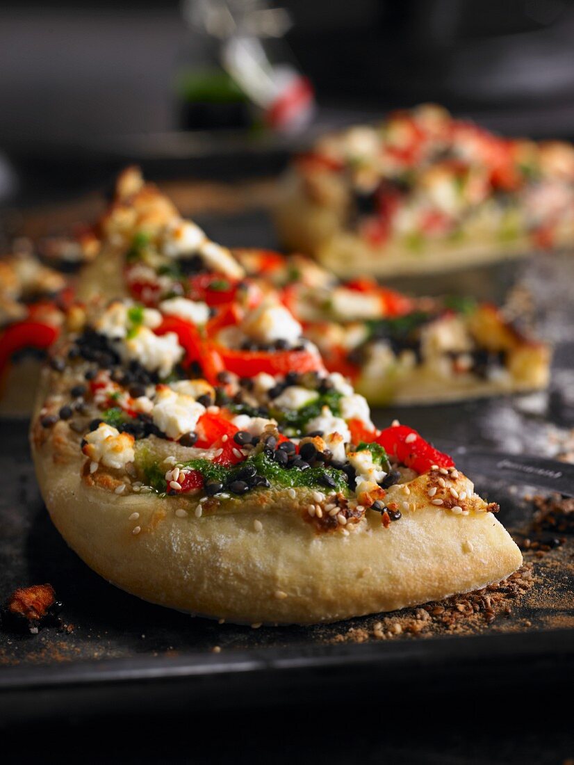 Lentil pizza with grilled peppers and sheep's cheese