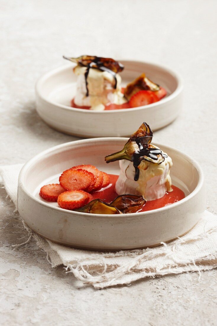 Baked goat's cheese with white chocolate, strawberry sauce and aubergine