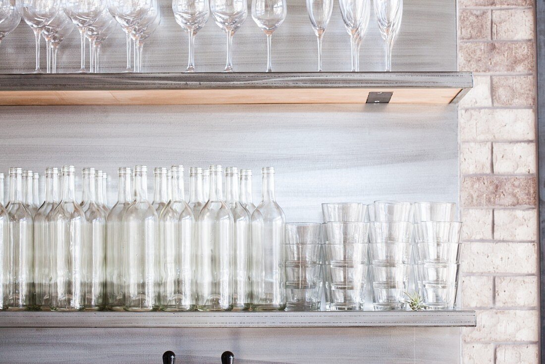 Empty Bottles and Glasses on Shelves