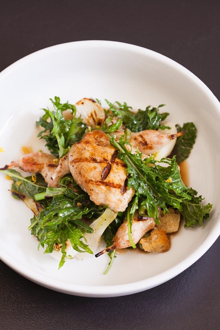 Grilled Quail with Wilted Baby Kale Salad and Onions