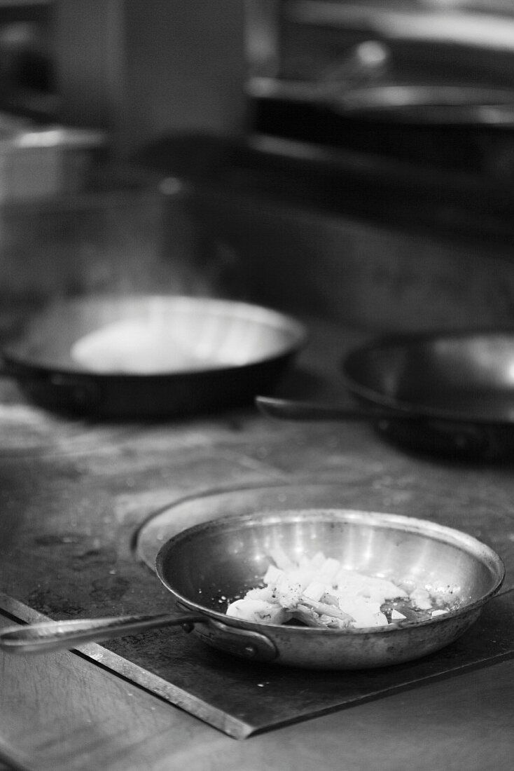 Skillets on a Commercial Oven; Black and White