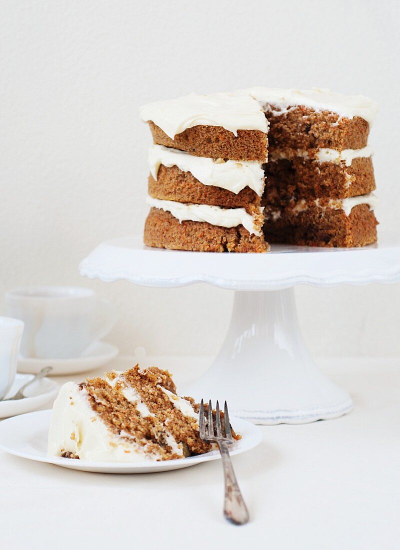 Carrot cake with cream cheese frosting, one slice served