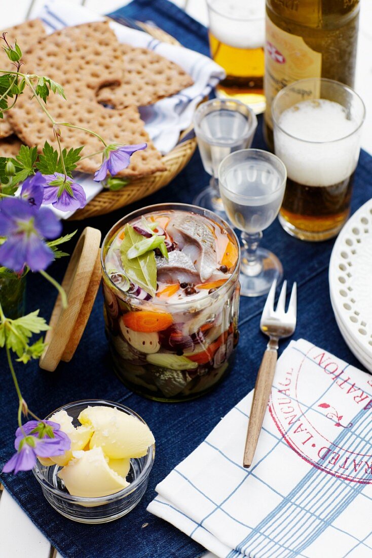 Pickled herring with crispbread and beer