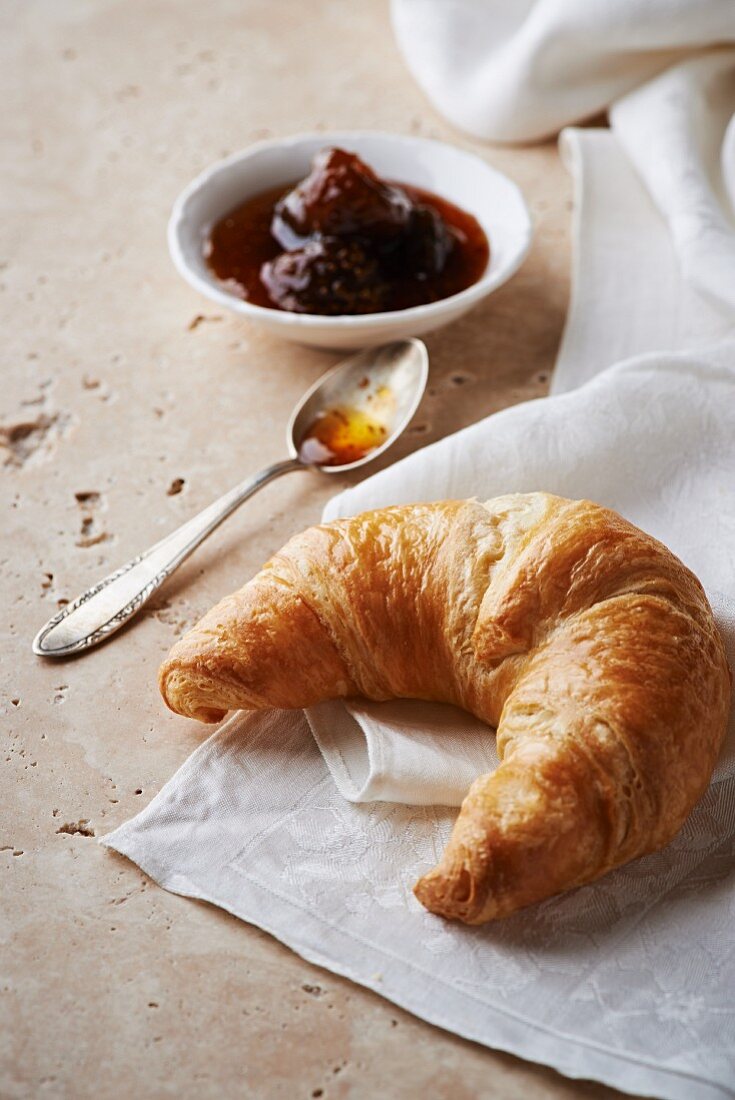 A croissant and fig jam