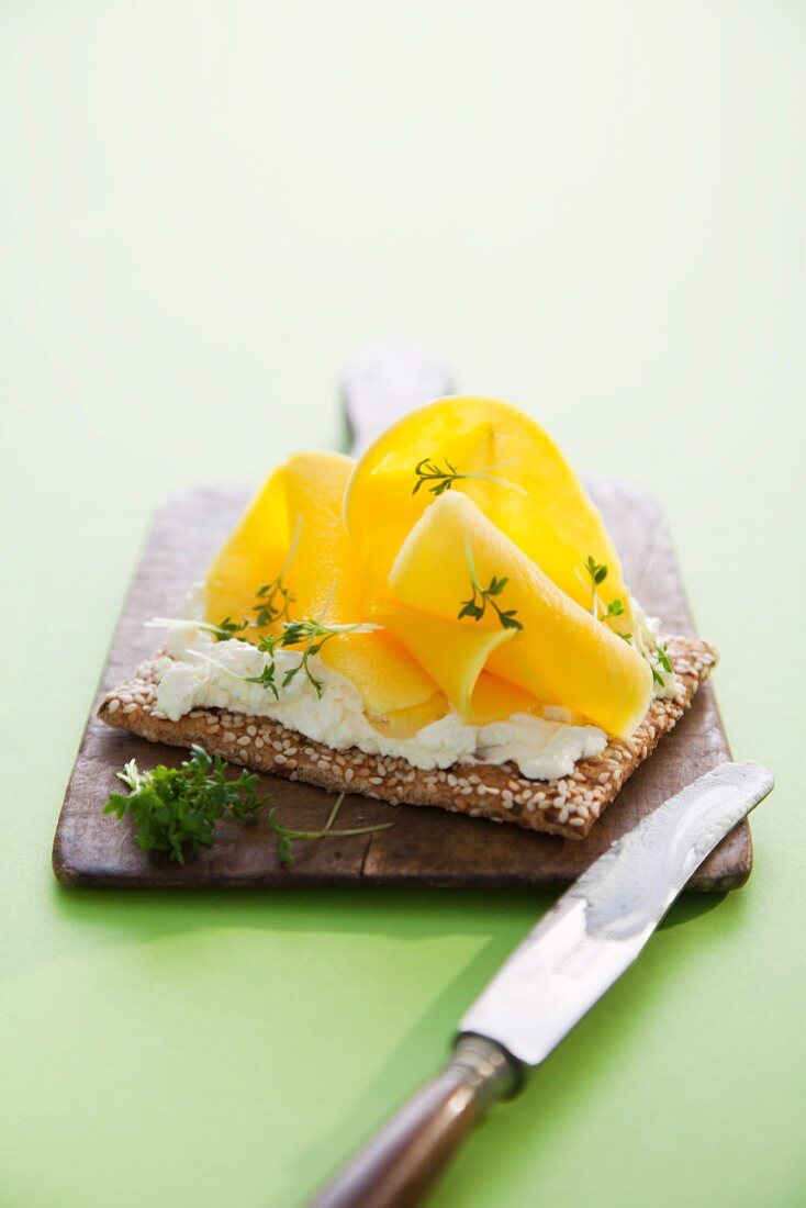Mango and cream cheese on a cracker