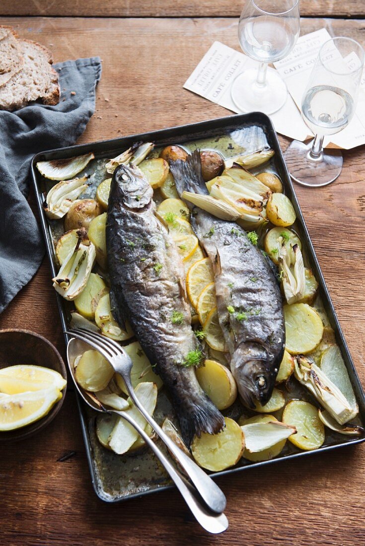 Baked trout with potatoes and lemons