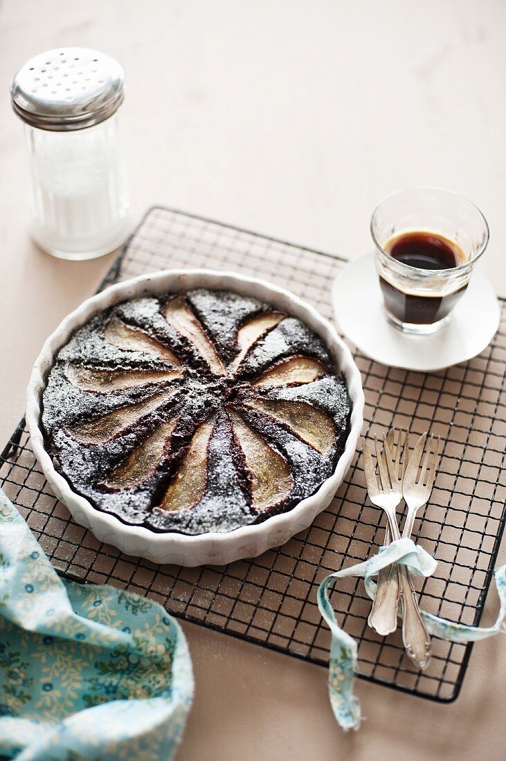 Chocolate and pear tart and a cup of coffee