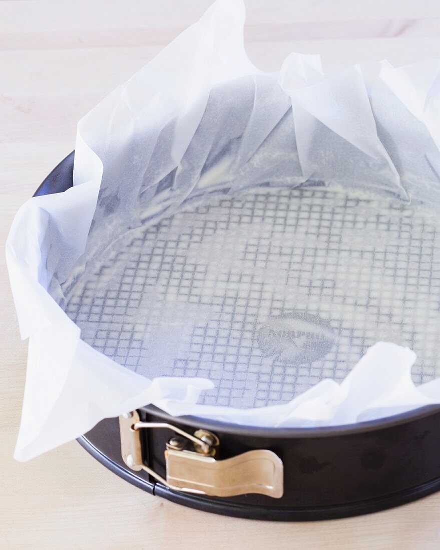 A Springform Pan Lined with Parchment Paper