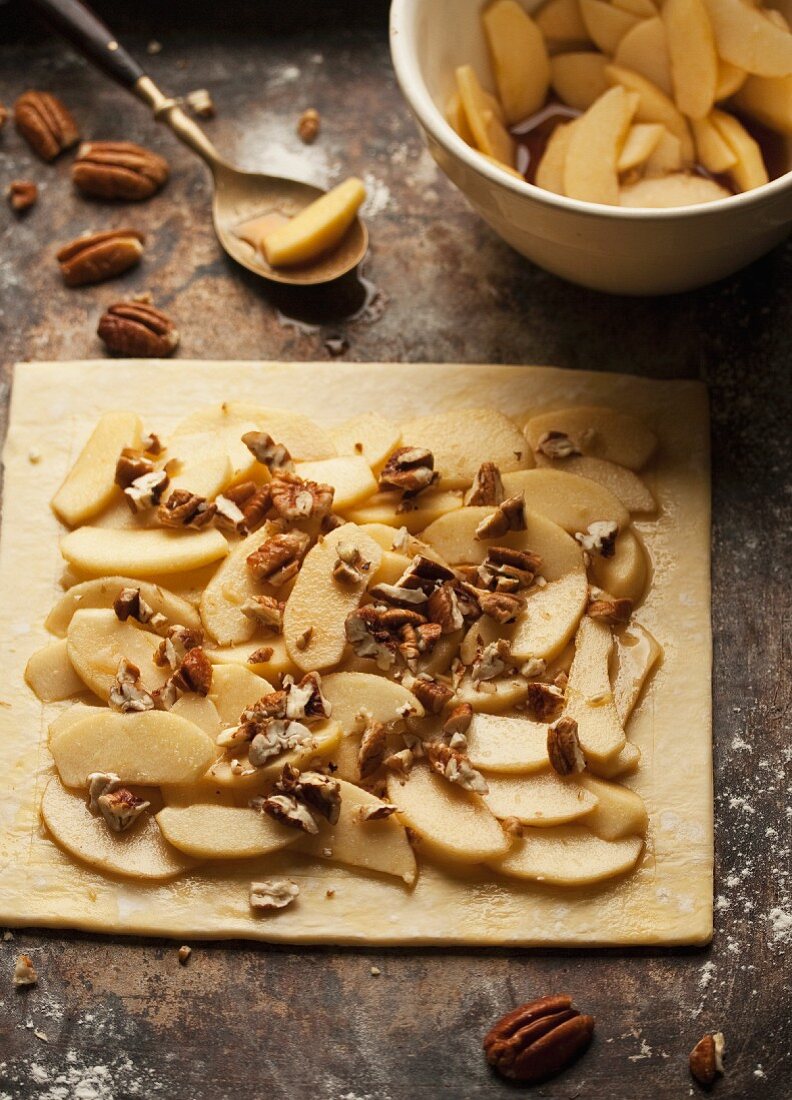 Puff pastry topped with apples and pecan nuts
