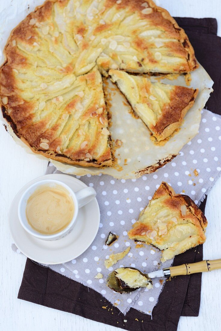 Pear tart with chocolate and a cup of coffee