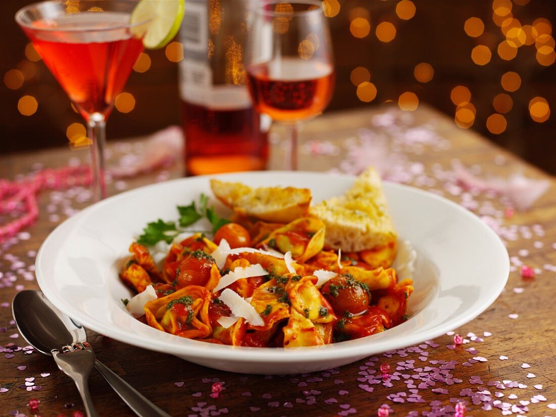 Pasta with tomatoes, spinach and ricotta at a party buffet