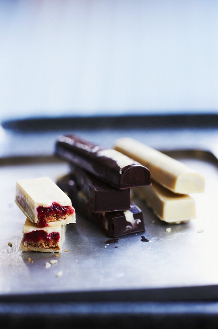 Home-made bars of chocolate filled with caramel and with jam