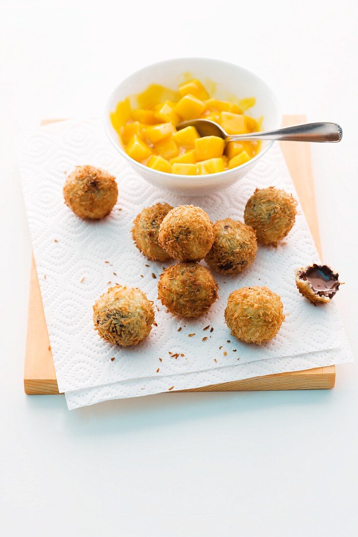 Deep-fried chocolate and coconut balls with mango